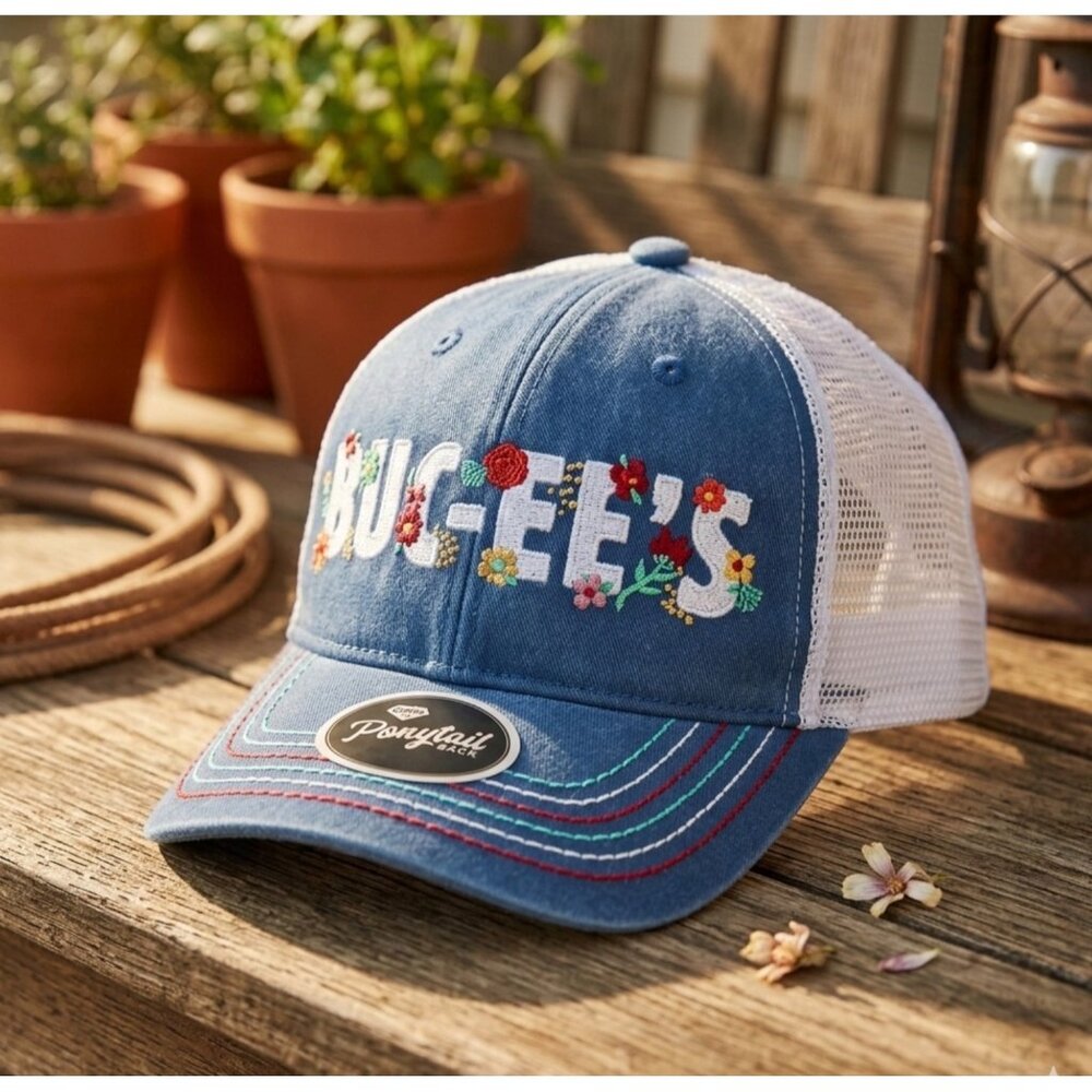 Buc-ees Ladies Fit Ponytail Back Embroidered Trucker Hat With Floral Design Blue